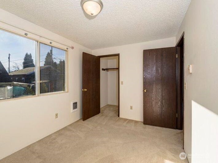 3718 Rockefeller Avenue, Unit A D Everett, WA 98201 - Photo 8 of 8 a view of an empty room with a window