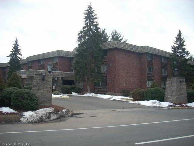 233 Ellington Road, Unit 207 East Hartford, CT 06108 - Photo 1 of 1 a street view along with road and trees