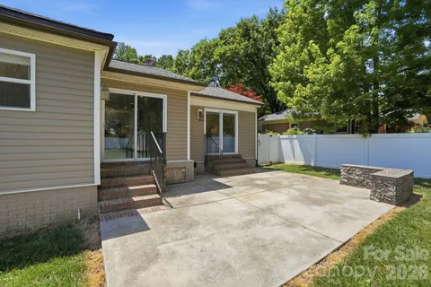 a backyard of a house with seating space