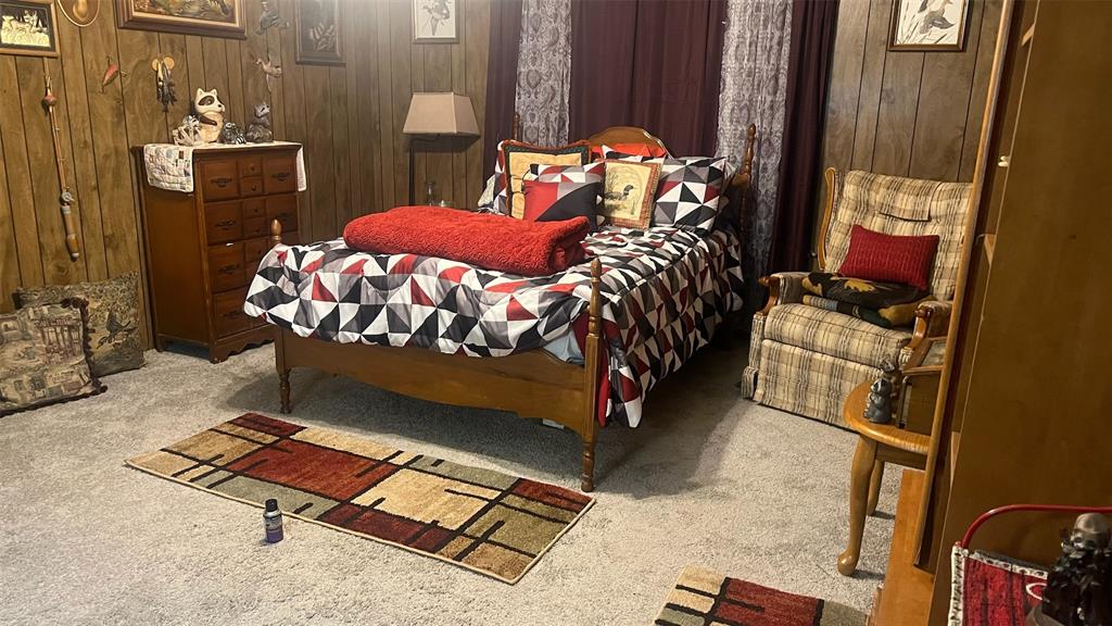 413 Park Avenue Minden, LA 71055 - Photo 3 of 5 a bed sitting in a bedroom next to a window