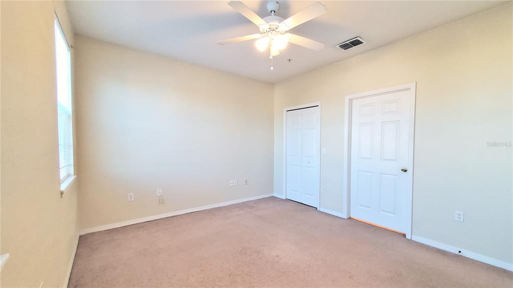 3406 Soho Street, Unit 303 Orlando, FL 32835 - Photo 14 of 19 a view of an empty room
