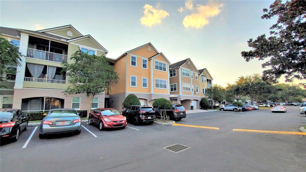 3406 Soho Street, Unit 303 Orlando, FL 32835 - Photo 16 of 19 a car parked in front of a house