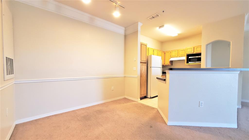 3406 Soho Street, Unit 303 Orlando, FL 32835 - Photo 7 of 19 a view of a kitchen with a sink