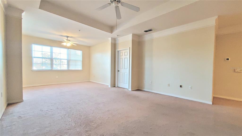 3406 Soho Street, Unit 303 Orlando, FL 32835 - Photo 10 of 19 a view of an empty room with a window