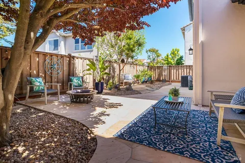 a view of a backyard with sitting area