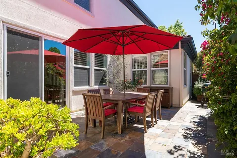 a view of a dinning tables and chairs in the patio