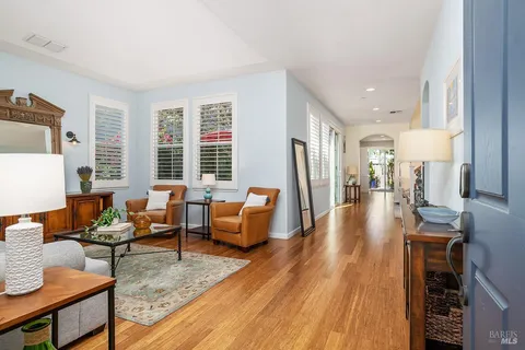 a living room with furniture and a table