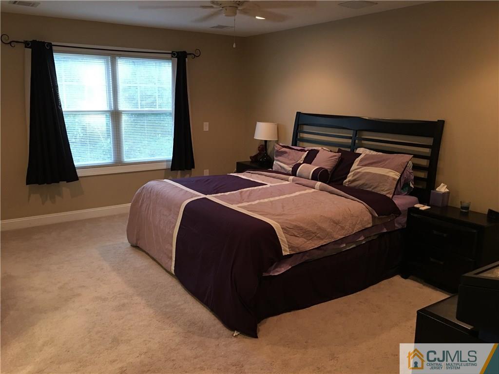 67 Ashley Road Edison, NJ 08817 - Photo 13 of 17 a bedroom with a bed and a window