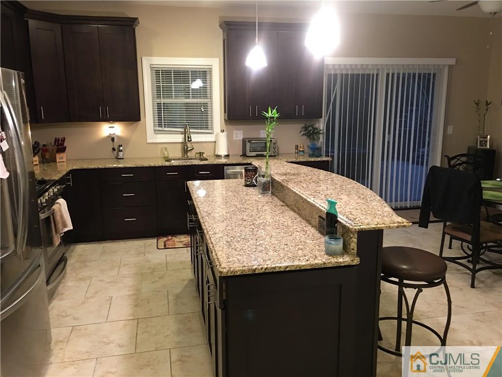 67 Ashley Road Edison, NJ 08817 - Photo 16 of 17 a kitchen with a counter space and a sink