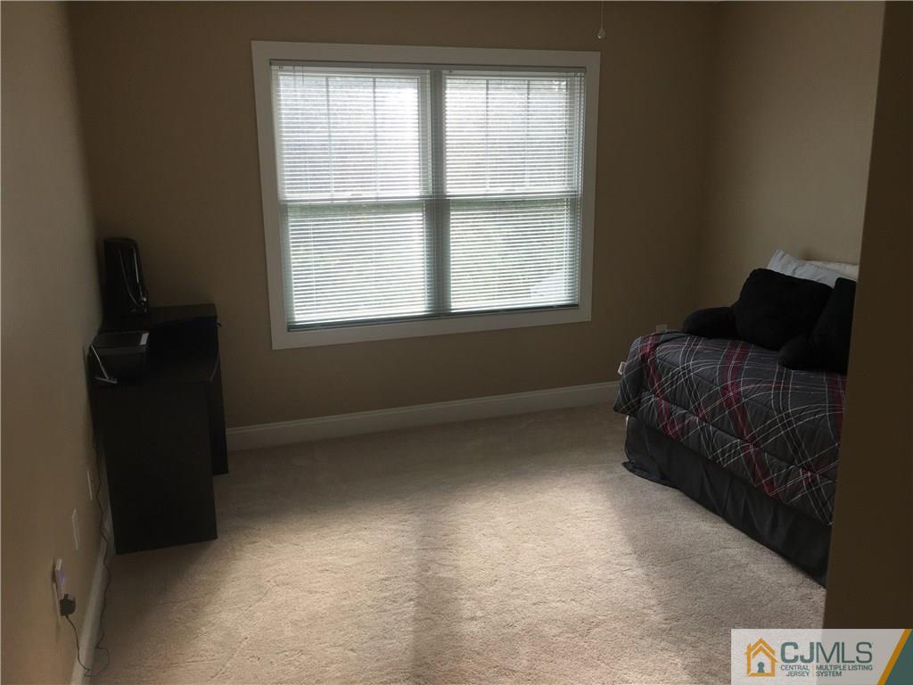 67 Ashley Road Edison, NJ 08817 - Photo 7 of 17 a living room with furniture and a window