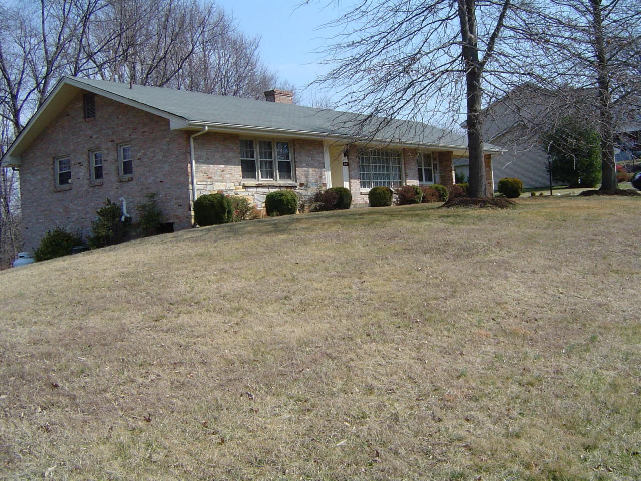 4649 Rosecrest Road Roanoke, VA 24018 - Photo 1 of 24 a front view of a house with a yard and a garage