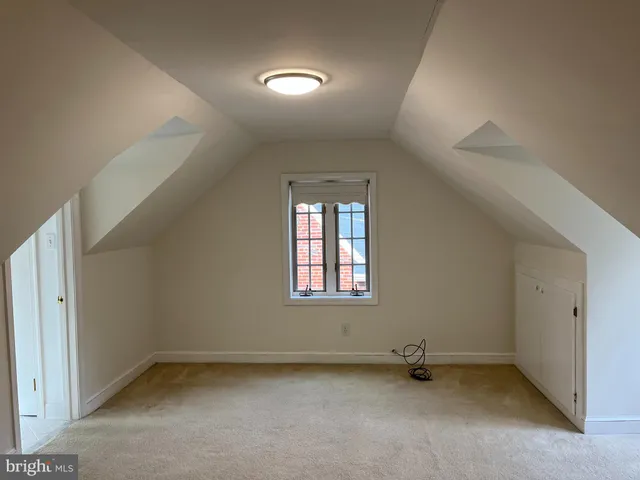 a bathroom with a bathtub and window