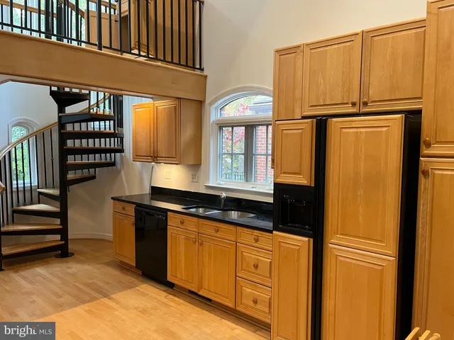 a view of a kitchen with a sink