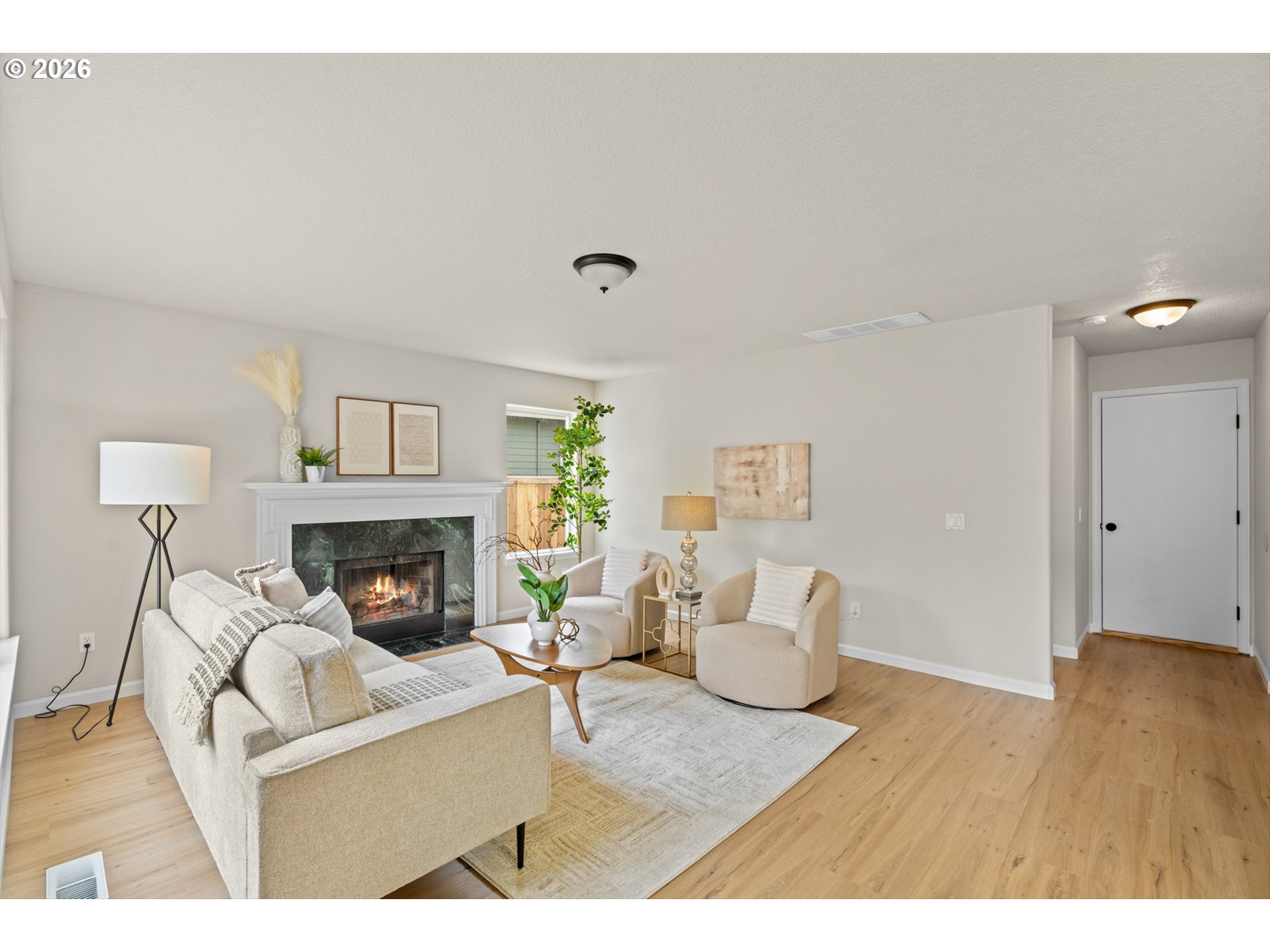 462 Southwest 211th Avenue Beaverton, OR 97006 - Photo 11 of 40 a living room with furniture and a fireplace