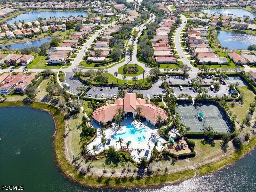 19694 Villa Rosa Loop Estero, FL 33967 - Photo 26 of 28 an aerial view of a house with a swimming pool yard and lake view