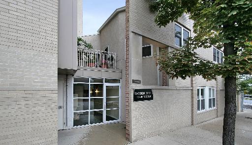 1834 Ridge Avenue, Unit 119 Evanston, IL 60201 - Photo 1 of 1 a front view of a house with a tree