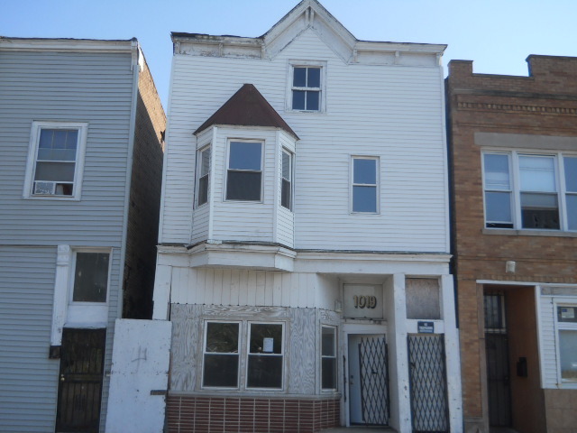 a front view of a house with a door