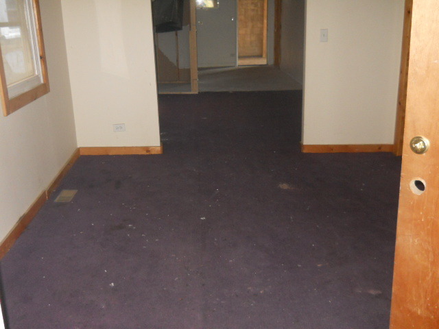 1019 West 69th Street Chicago, IL 60621 - Photo 11 of 17 a view of a small space with wooden floor and a window