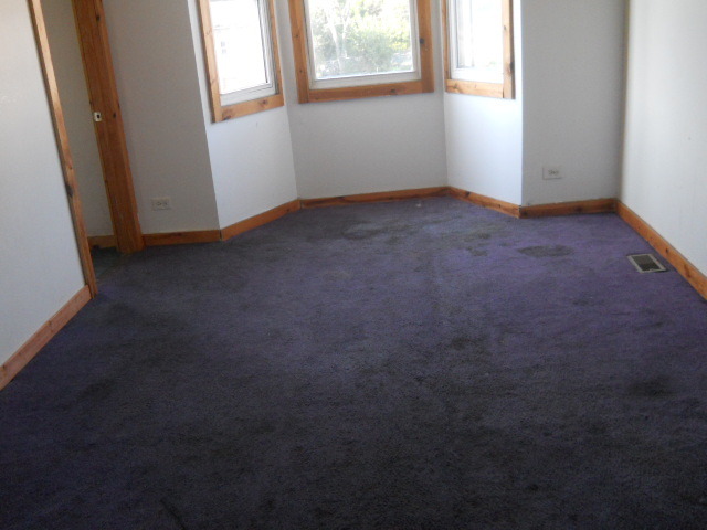 1019 West 69th Street Chicago, IL 60621 - Photo 12 of 17 an empty room with windows