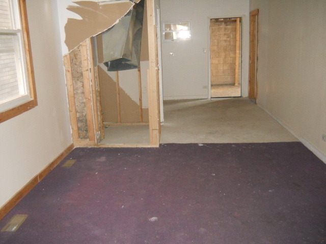 1019 West 69th Street Chicago, IL 60621 - Photo 14 of 17 an empty room with a window