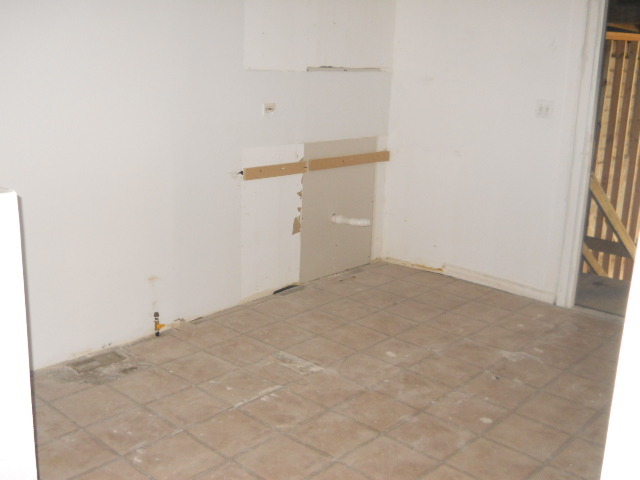 1019 West 69th Street Chicago, IL 60621 - Photo 8 of 17 a view of a room with racks on the wall