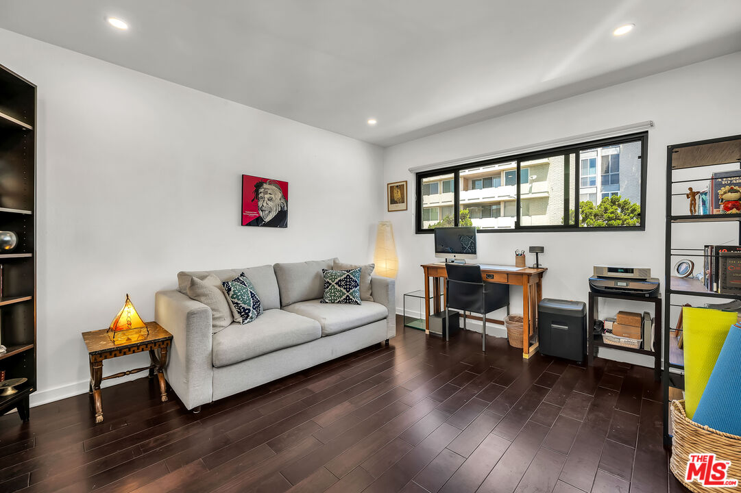 7300 Franklin Avenue, Unit 548 Los Angeles, CA 90046 - Photo 11 of 15 a living room with furniture and wooden floor