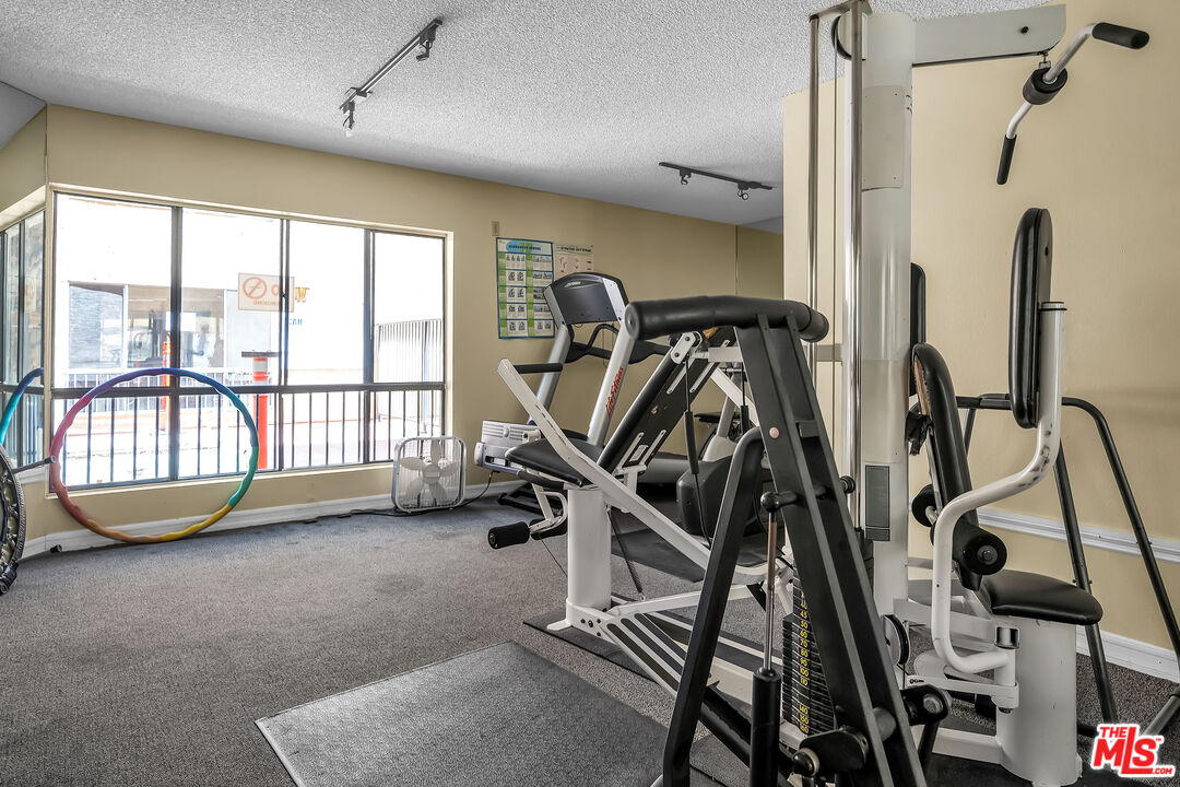 7300 Franklin Avenue, Unit 548 Los Angeles, CA 90046 - Photo 14 of 15 a view of a room with gym equipment