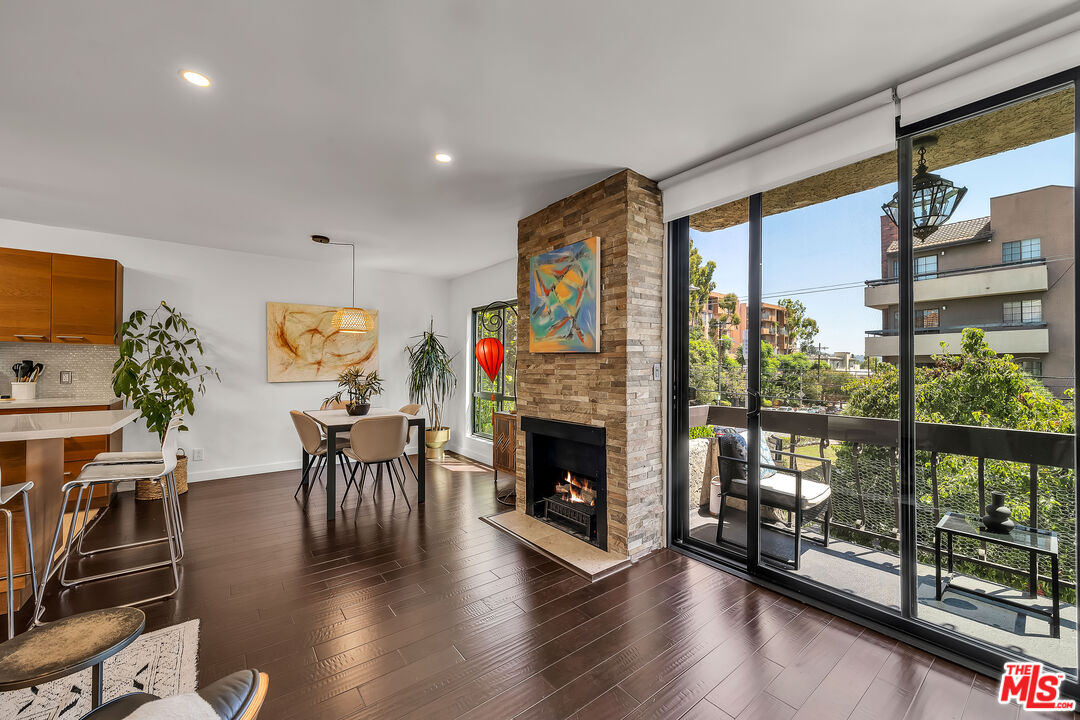 7300 Franklin Avenue, Unit 548 Los Angeles, CA 90046 - Photo 4 of 15 a view of a dining room with furniture window and wooden floor