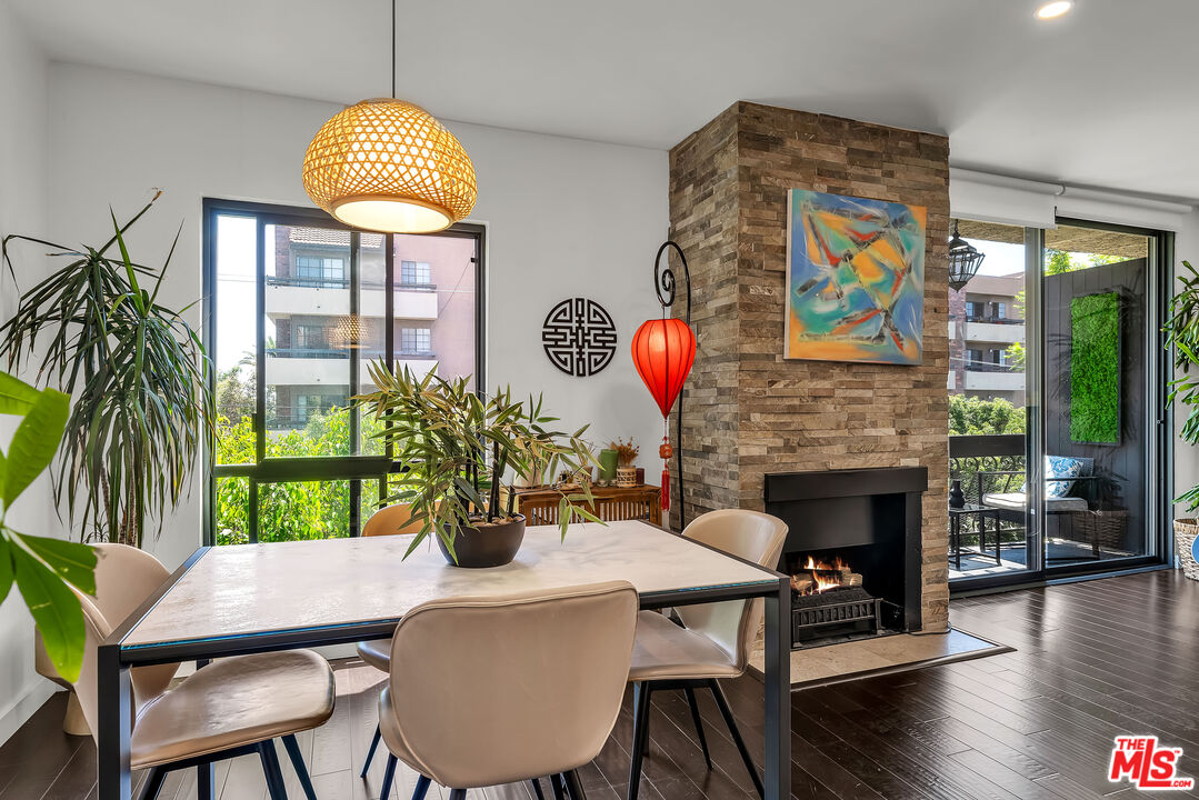 7300 Franklin Avenue, Unit 548 Los Angeles, CA 90046 - Photo 5 of 15 a view of a dining room with furniture window and wooden floor