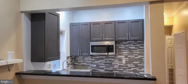 a living room with fireplace furniture and a flat screen tv