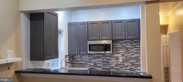 a living room with fireplace furniture and a flat screen tv
