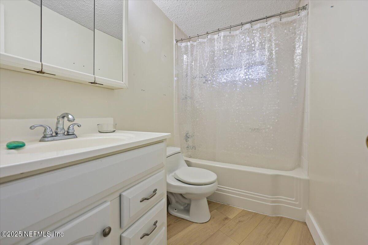 367 7th Street Atlantic Beach, FL 32233 - Photo 13 of 25 a bathroom with a sink a toilet and shower