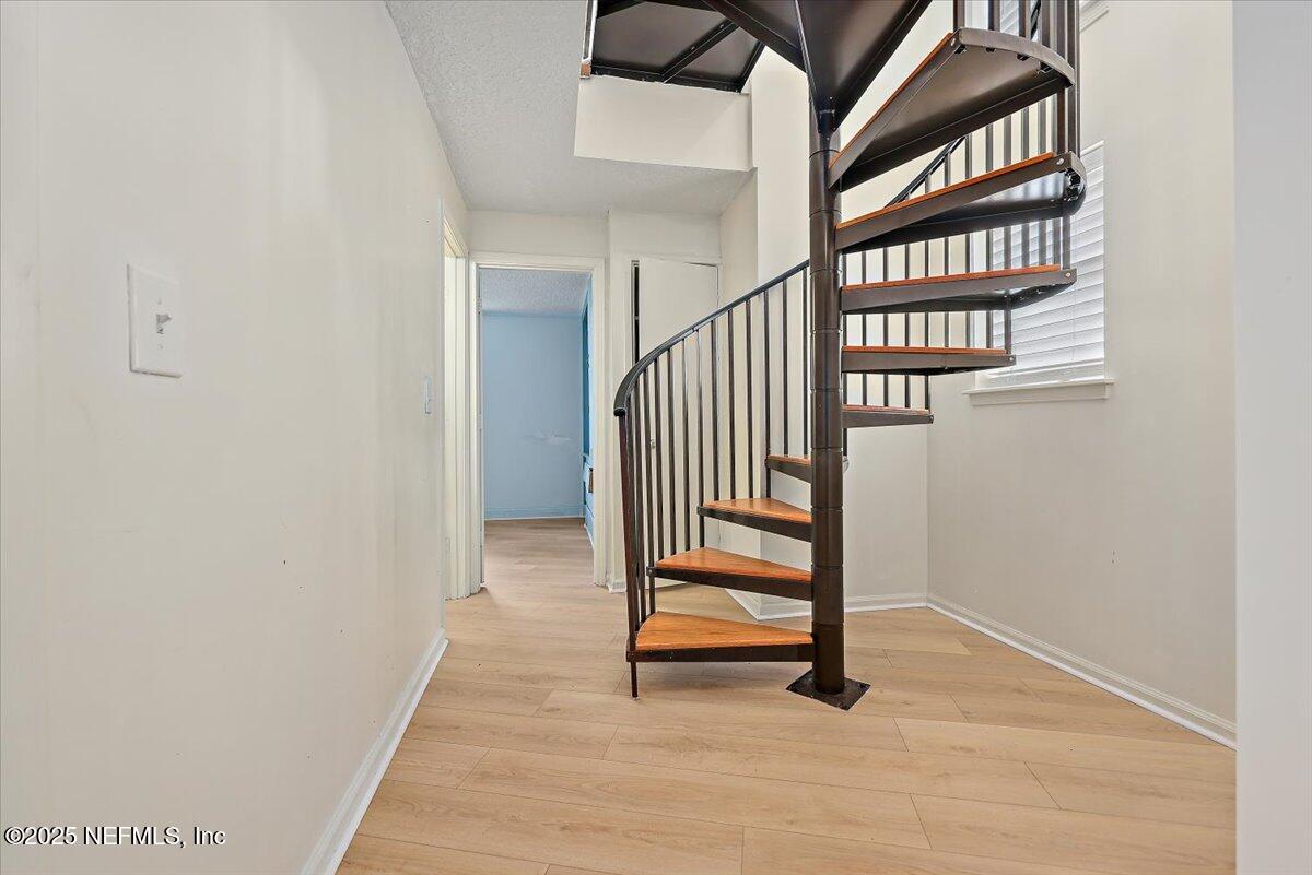 367 7th Street Atlantic Beach, FL 32233 - Photo 15 of 25 a view of staircase with white walls and a window