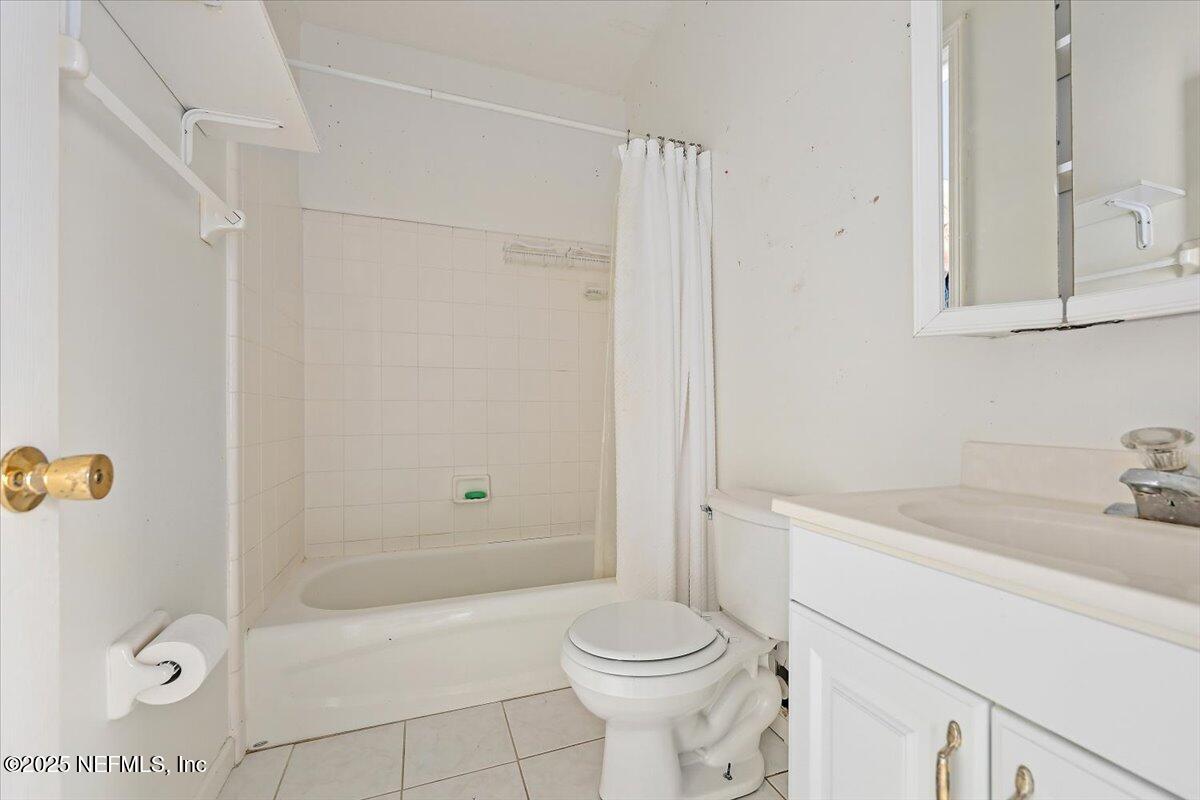 367 7th Street Atlantic Beach, FL 32233 - Photo 18 of 25 a bathroom with a sink a toilet and shower