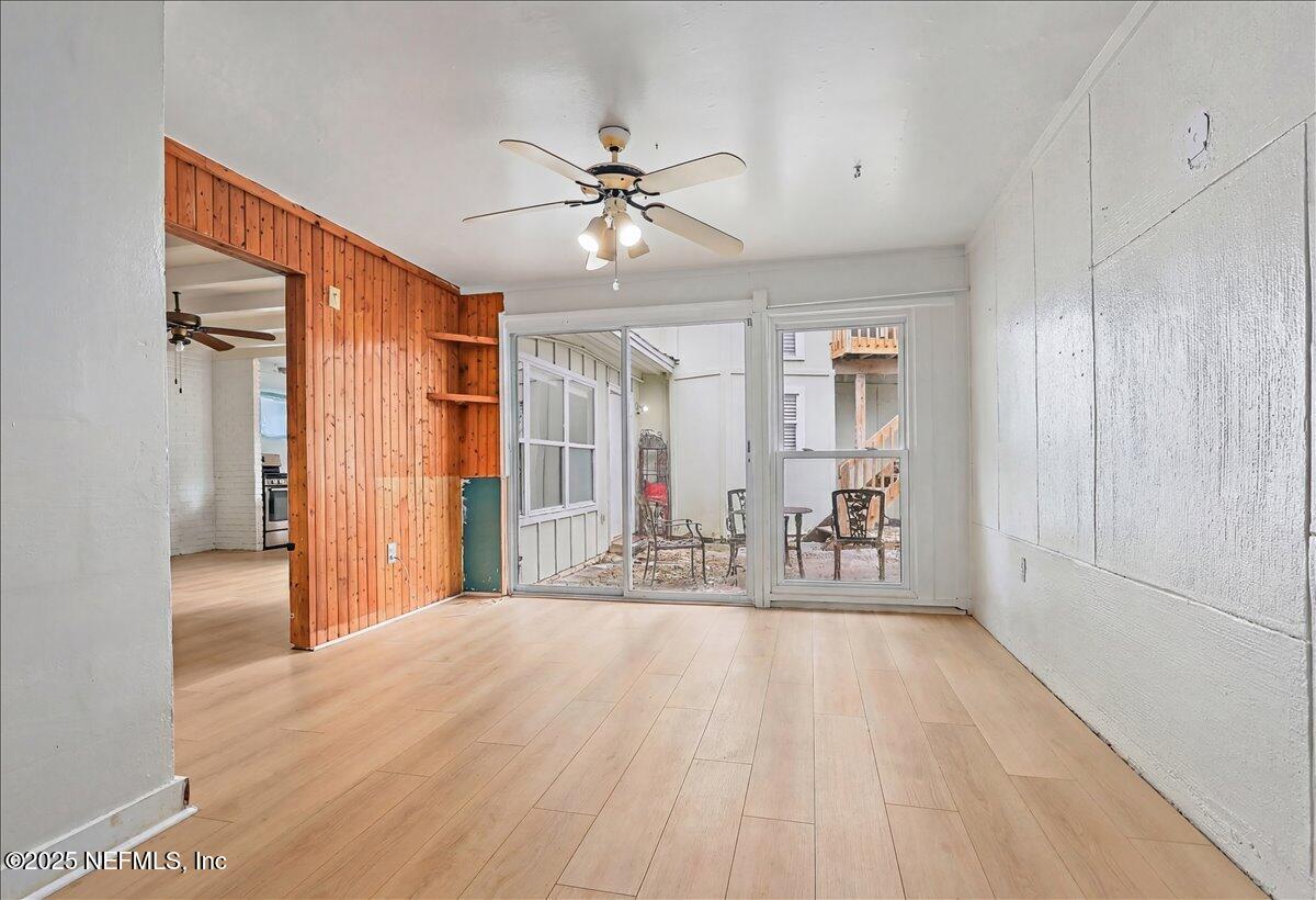 367 7th Street Atlantic Beach, FL 32233 - Photo 5 of 25 a view of a livingroom with wooden floor and a ceiling fan