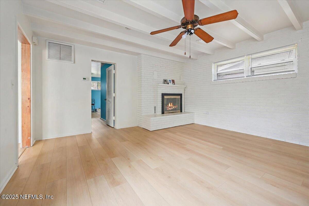 367 7th Street Atlantic Beach, FL 32233 - Photo 6 of 25 a view of livingroom with hardwood floor and a ceiling fan