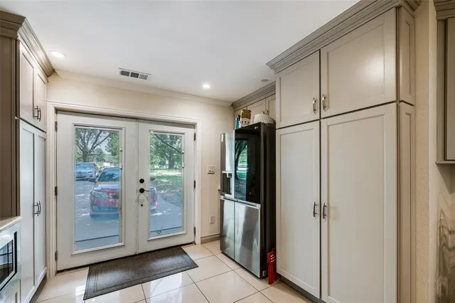 a view of a refrigerator in kitchen and wooden floor