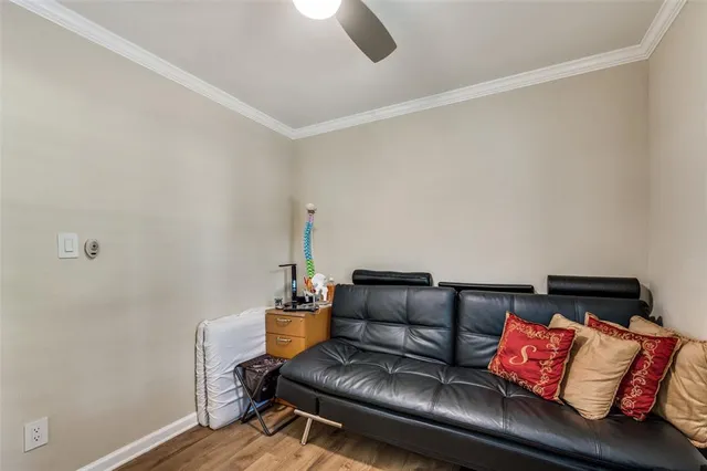 a living room with furniture and a lamp