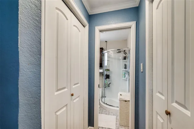 a bathroom with a glass shower door