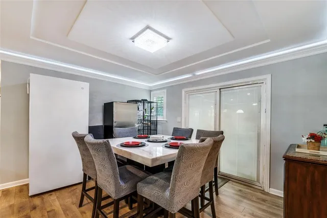 a view of a dining room with furniture and wooden floor