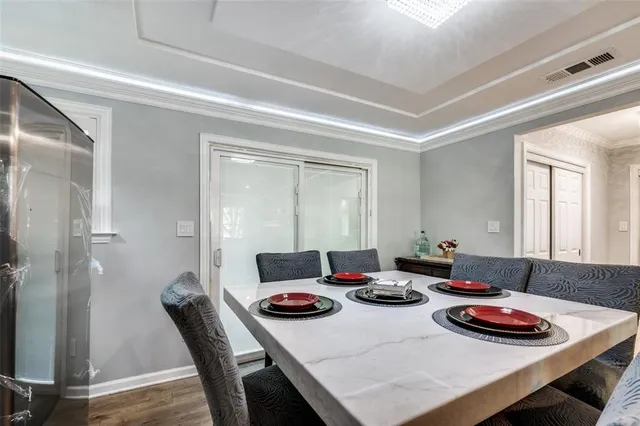 a view of a dining room and livingroom with furniture