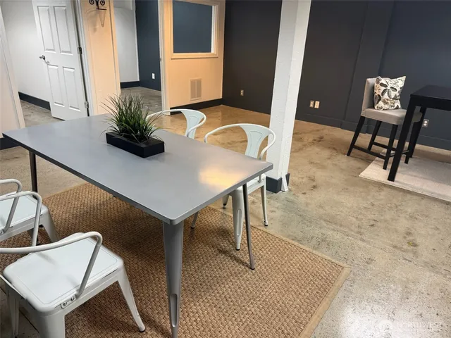 a workspace with furniture and window