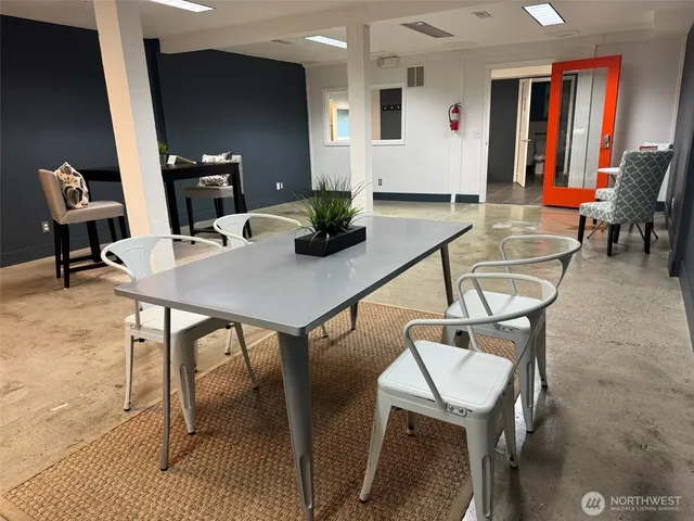 a workspace with furniture and wooden floor