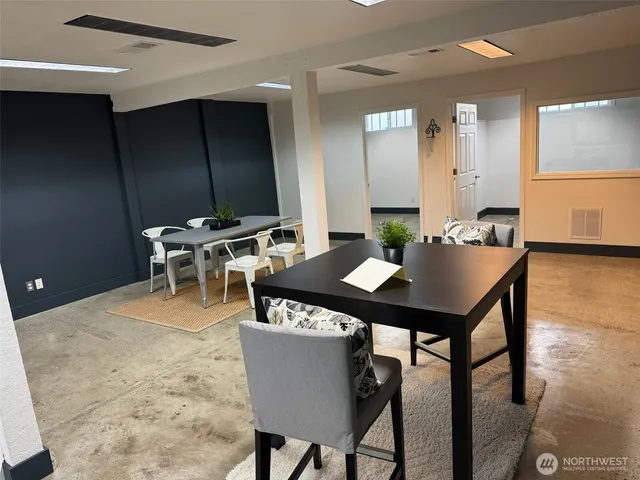 a view of a dining room with tables and chairs