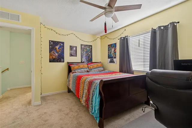 a bed room with a bed and a couch