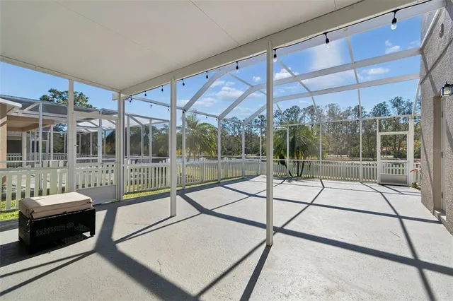 a view of a living room and a porch with furniture