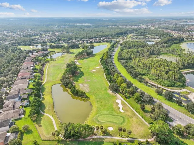 an aerial view of a house with a lake view