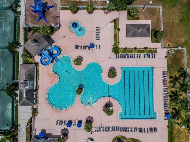 an aerial view of a golf course with parking space