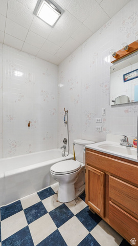 44 Shriver Street Eureka, UT 84628 - Photo 11 of 43 Full bathroom featuring a white bathtub, toilet, and wood-finish vanity with an integrated sink