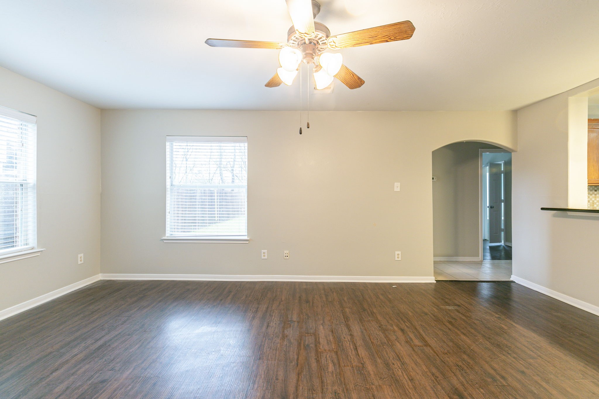 5601 Savannah Woods Lane Rosharon, TX 77583 - Photo 13 of 43 an empty room with wooden floor and windows